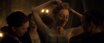 Movie still from “Mary Queen of Scots” (2018), directed by Josie Rourke – A young woman standing in front of a bathroom mirror; Close Up shot, Over the shoulder angle