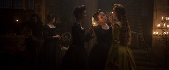 Movie still from “Mary Queen of Scots” (2018), directed by Josie Rourke – A group of women dressed in period clothing; Medium shot, Over the shoulder angle