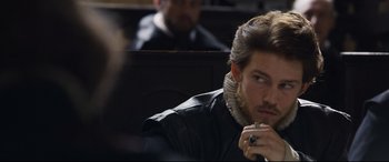 Movie still from “Mary Queen of Scots” (2018), directed by Josie Rourke – A person sitting in a chair; Close Up shot, Over the shoulder angle