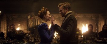 Movie still from “Mary Queen of Scots” (2018), directed by Josie Rourke – A man and a woman dancing in front of a fireplace; Medium shot, Over the shoulder angle