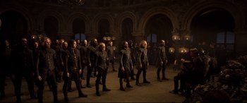 Movie still from “Mary Queen of Scots” (2018), directed by Josie Rourke – A group of men in military garb are walking in formation; Wide shot, High angle