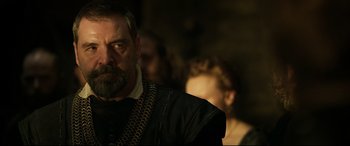 Movie still from “Mary Queen of Scots” (2018), directed by Josie Rourke – A person wearing a black jacket; Close Up shot, Over the shoulder angle