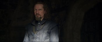 Movie still from “Mary Queen of Scots” (2018), directed by Josie Rourke – A man with long hair and a beard; Close Up shot, Over the shoulder angle