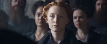 Movie still from “Mary Queen of Scots” (2018), directed by Josie Rourke – A group of people standing next to each other; Close Up shot, Over the shoulder angle
