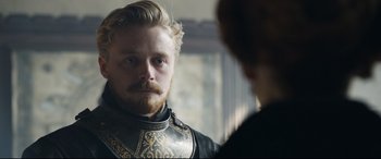 Movie still from “Mary Queen of Scots” (2018), directed by Josie Rourke – A person wearing a suit of armor; Close Up shot, Over the shoulder angle