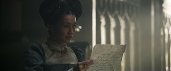 Movie still from “Mary Queen of Scots” (2018), directed by Josie Rourke – A woman holding an old letter in her hands; Close Up shot, Over the shoulder angle