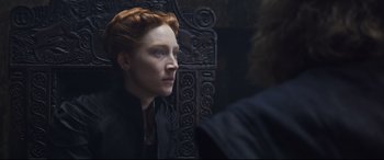 Movie still from “Mary Queen of Scots” (2018), directed by Josie Rourke – A red headed woman looking into a mirror; Close Up shot, Over the shoulder angle