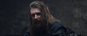 Movie still from “Mary Queen of Scots” (2018), directed by Josie Rourke – A man with long hair and a long beard; Close Up shot, Over the shoulder angle