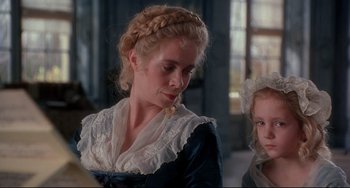 Movie still from “Frankenstein” (1994), directed by Kenneth Branagh – A woman and a little girl in a room; Close Up shot, Over the shoulder angle