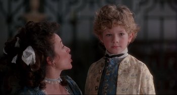 Movie still from “Frankenstein” (1994), directed by Kenneth Branagh – A woman and a boy in a costume; Close Up shot, Over the shoulder angle