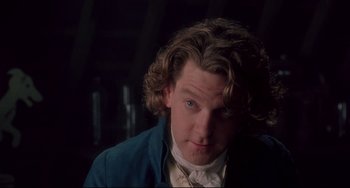 Movie still from “Frankenstein” (1994), directed by Kenneth Branagh – A person wearing a blue jacket; Close Up shot, Over the shoulder angle