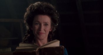 Movie still from “Frankenstein” (1994), directed by Kenneth Branagh – A woman is holding an open book in her hands; Close Up shot, Low angle