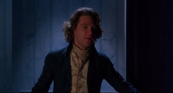 Movie still from “Frankenstein” (1994), directed by Kenneth Branagh – A man with long blonde hair wearing a suit; Medium shot, Low angle