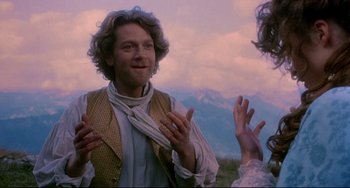 Movie still from “Frankenstein” (1994), directed by Kenneth Branagh – A man wearing a vest is talking to two women; Medium shot, Over the shoulder angle