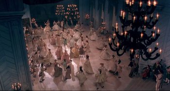 Movie still from “Frankenstein” (1994), directed by Kenneth Branagh – A large group of people dancing in a room; Extreme Wide shot, High angle