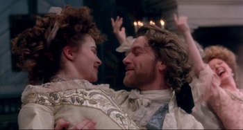 Movie still from “Frankenstein” (1994), directed by Kenneth Branagh – A man and a woman are dancing in a room; Medium shot, Low angle