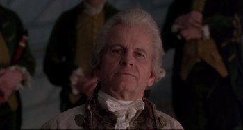 Movie still from “Frankenstein” (1994), directed by Kenneth Branagh – An old man with a white beard and a white wig; Close Up shot, Low angle