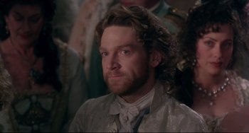Movie still from “Frankenstein” (1994), directed by Kenneth Branagh – A person with long hair; Close Up shot, Over the shoulder angle