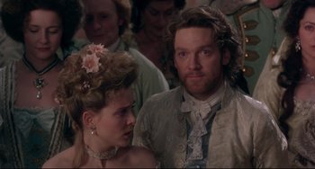 Movie still from “Frankenstein” (1994), directed by Kenneth Branagh – A man and a woman standing next to each other in front of a crowd; Close Up shot, Over the shoulder angle