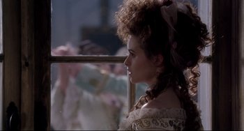 Movie still from “Frankenstein” (1994), directed by Kenneth Branagh – A woman in a victorian dress looking out of a window; Close Up shot, Over the shoulder angle