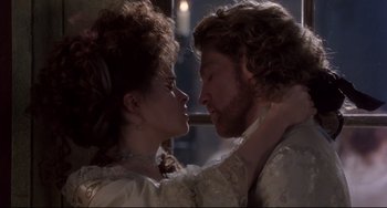 Movie still from “Frankenstein” (1994), directed by Kenneth Branagh – A man and a woman are kissing each other; Close Up shot, Over the shoulder angle