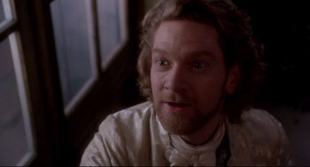 Movie still from “Frankenstein” (1994), directed by Kenneth Branagh – A person with a beard; Close Up shot, High angle