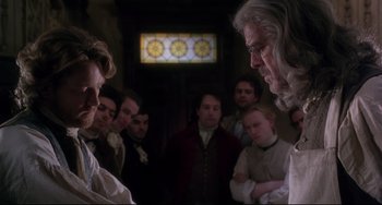 Movie still from “Frankenstein” (1994), directed by Kenneth Branagh – A group of people standing in front of each other in a room; Medium shot, Over the shoulder angle