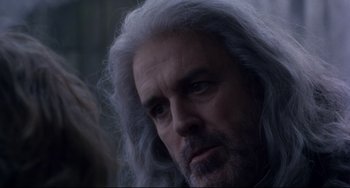 Movie still from “Frankenstein” (1994), directed by Kenneth Branagh – A person with long white hair; Close Up shot, Over the shoulder angle