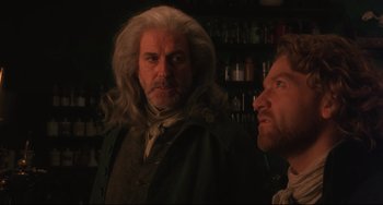 Movie still from “Frankenstein” (1994), directed by Kenneth Branagh – A man with long white hair standing next to another man with long white hair; Close Up shot, Over the shoulder angle