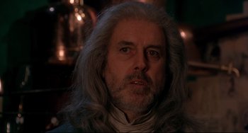 Movie still from “Frankenstein” (1994), directed by Kenneth Branagh – A person with long white hair; Close Up shot, Over the shoulder angle