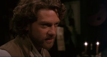Movie still from “Frankenstein” (1994), directed by Kenneth Branagh – A person with a beard; Close Up shot, Over the shoulder angle