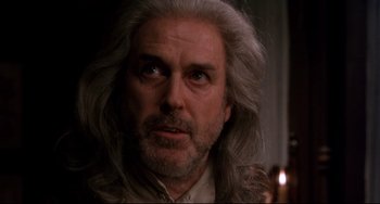 Movie still from “Frankenstein” (1994), directed by Kenneth Branagh – An older man with long white hair looking at the camera; Close Up shot, Low angle