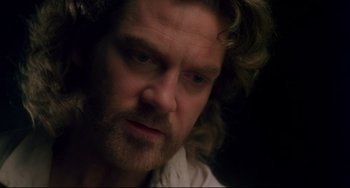 Movie still from “Frankenstein” (1994), directed by Kenneth Branagh – A person with long hair; Close Up shot, Low angle