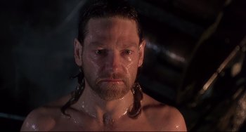Movie still from “Frankenstein” (1994), directed by Kenneth Branagh – A person with long hair; Close Up shot, High angle