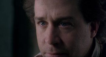 Movie still from “Frankenstein” (1994), directed by Kenneth Branagh – A man's face with blue eyes; Extreme Close Up shot, Over the shoulder angle