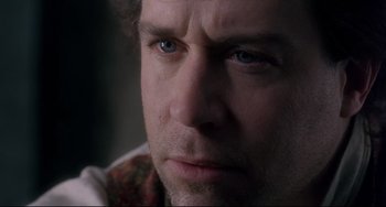 Movie still from “Frankenstein” (1994), directed by Kenneth Branagh – A man's face with a serious look; Close Up shot, Over the shoulder angle