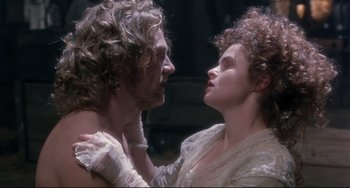 Movie still from “Frankenstein” (1994), directed by Kenneth Branagh – A man and a woman are looking into each others eyes; Close Up shot, High angle