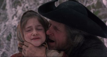 Movie still from “Frankenstein” (1994), directed by Kenneth Branagh – An old man holding a little girl in his arms; Close Up shot, Over the shoulder angle