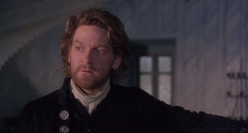 Movie still from “Frankenstein” (1994), directed by Kenneth Branagh – A person with long hair; Close Up shot, Over the shoulder angle