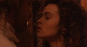 Movie still from “Frankenstein” (1994), directed by Kenneth Branagh – A man and a woman are kissing in a room; Close Up shot, Over the shoulder angle