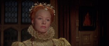 Movie still from “Mary, Queen of Scots” (1971), directed by Charles Jarrott – A person wearing a dress; Close Up shot, Over the shoulder angle