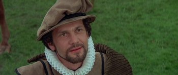 Movie still from “Mary, Queen of Scots” (1971), directed by Charles Jarrott – A person wearing a hat; Close Up shot, Over the shoulder angle