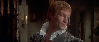 Movie still from “Mary, Queen of Scots” (1971), directed by Charles Jarrott – A person wearing a shirt; Close Up shot, Over the shoulder angle