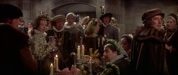 Movie still from “Mary, Queen of Scots” (1971), directed by Charles Jarrott – A group of people dressed in medieval clothing; Medium shot, High angle