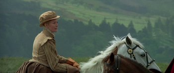 Movie still from “Mary, Queen of Scots” (1971), directed by Charles Jarrott – A woman riding on the back of a white horse; Medium shot, Low angle