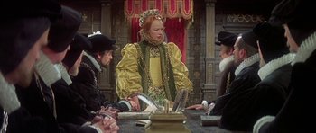Movie still from “Mary, Queen of Scots” (1971), directed by Charles Jarrott – A group of people sitting around a table; Medium shot, Over the shoulder angle