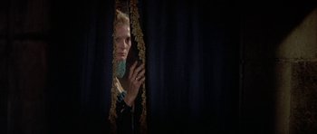 Movie still from “Mary, Queen of Scots” (1971), directed by Charles Jarrott – A woman looking at herself in a mirror; Medium shot, Low angle