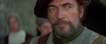 Movie still from “Mary, Queen of Scots” (1971), directed by Charles Jarrott – A person with a beard; Close Up shot, Over the shoulder angle