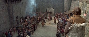 Movie still from “Mary, Queen of Scots” (1971), directed by Charles Jarrott – A group of people on horses in a field; Extreme Wide shot, High angle