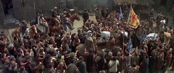 Movie still from “Mary, Queen of Scots” (1971), directed by Charles Jarrott – A crowd of people gathered around a man on a horse; Extreme Wide shot, High angle